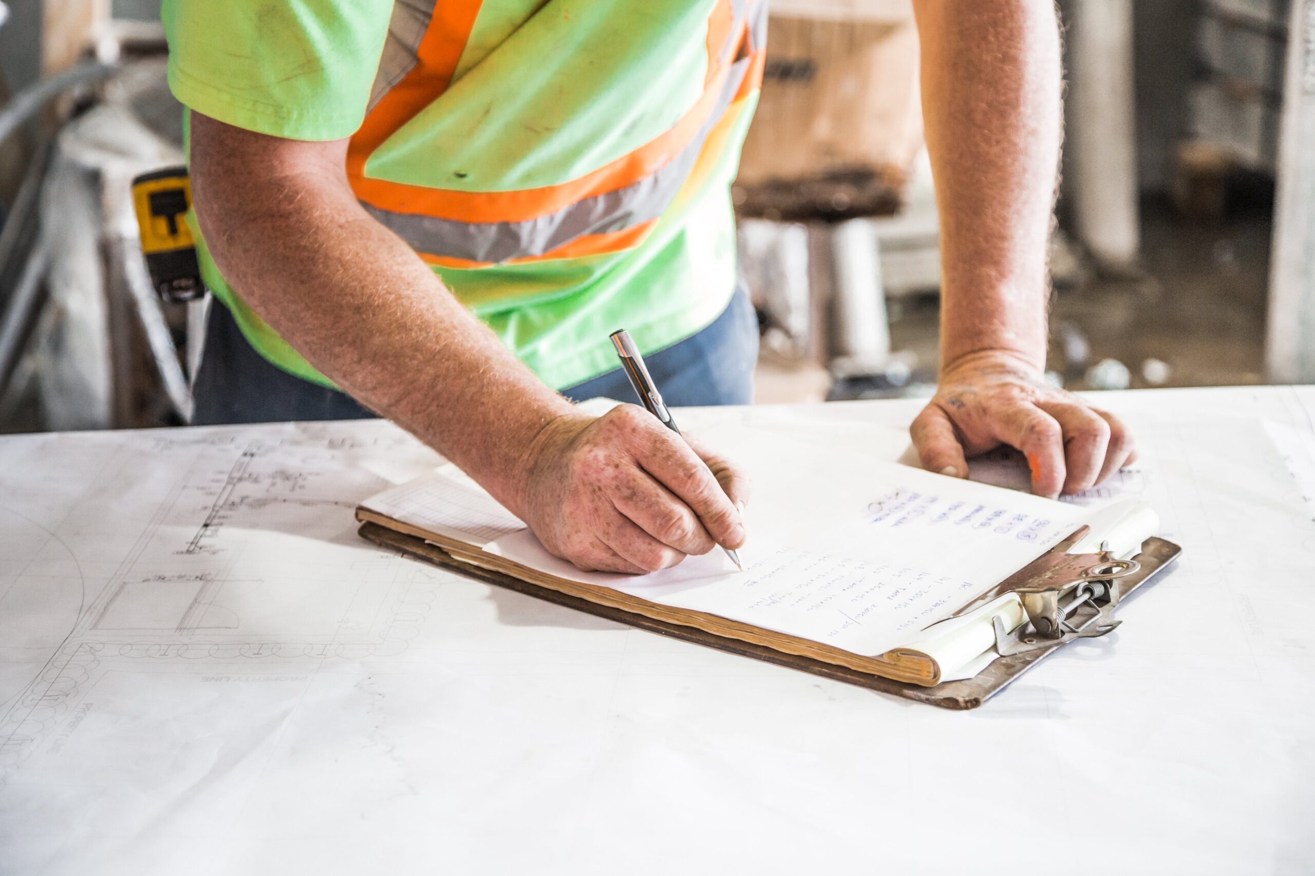 Person signing a checklist